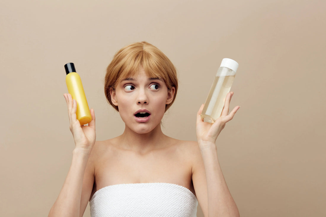 Woman comparing two hair care products, highlighting the importance of sulfate-free shampoo for colored hair.