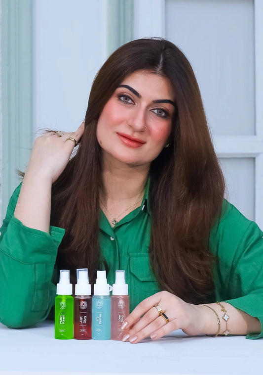 Nature's Melody collection showcasing four hair mist bottles with a model presenting them.